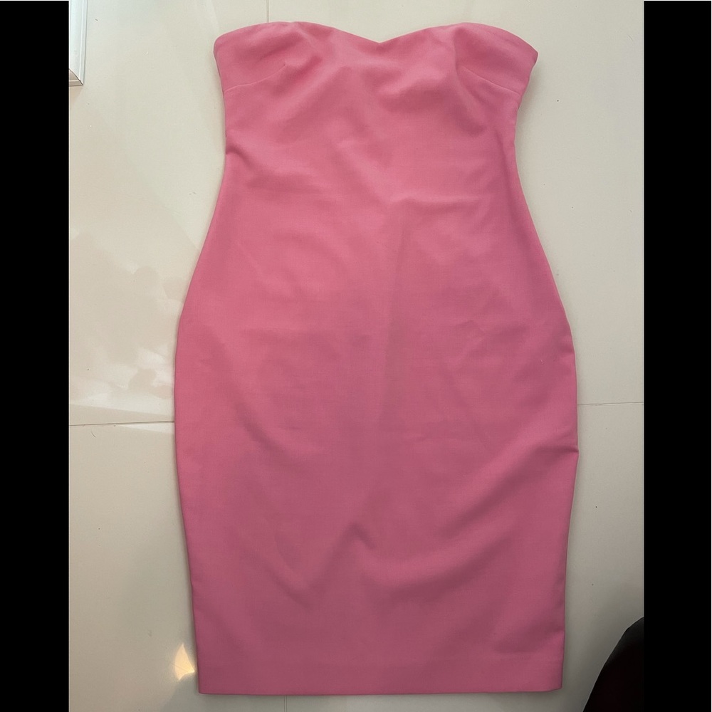 Pink strapless likely Midi dress.